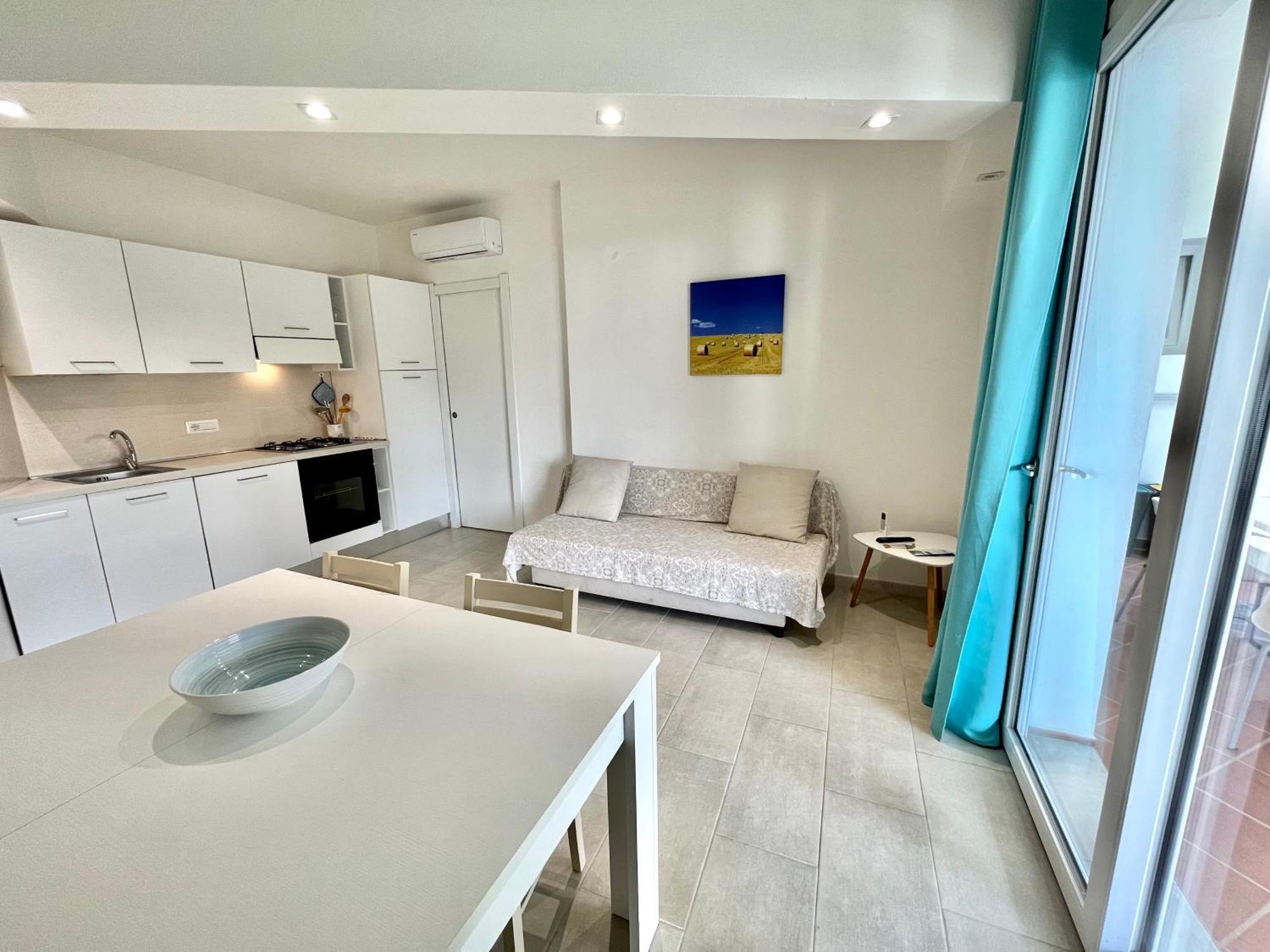 Angolo Mare Apartments & Rooms Porto Pino Exterior photo