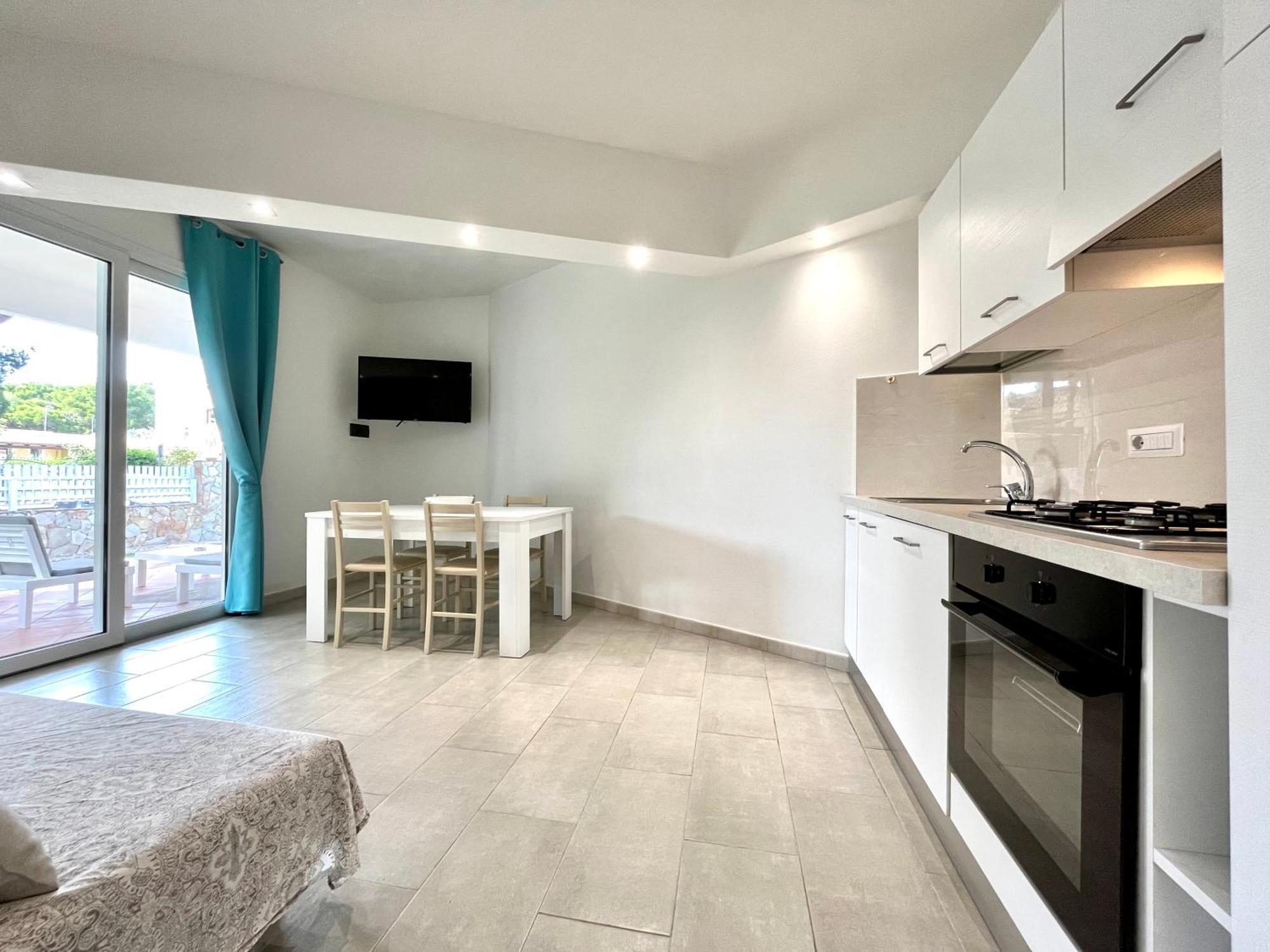 Angolo Mare Apartments & Rooms Porto Pino Exterior photo